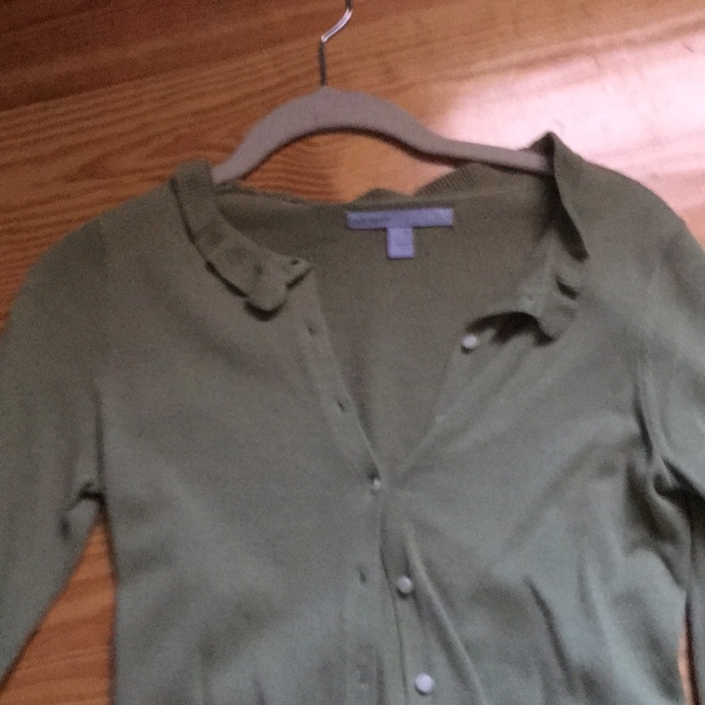 Feminine cardigan with ruffle neck